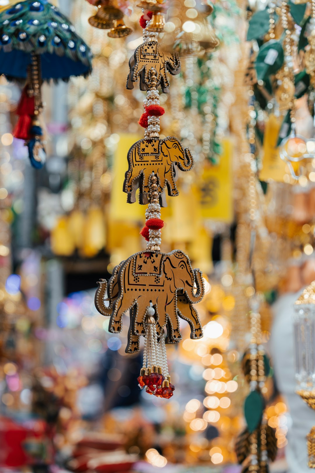services-bg decorative-elephant-ornaments-hanging-in-a-market-aa6ix6j1k74